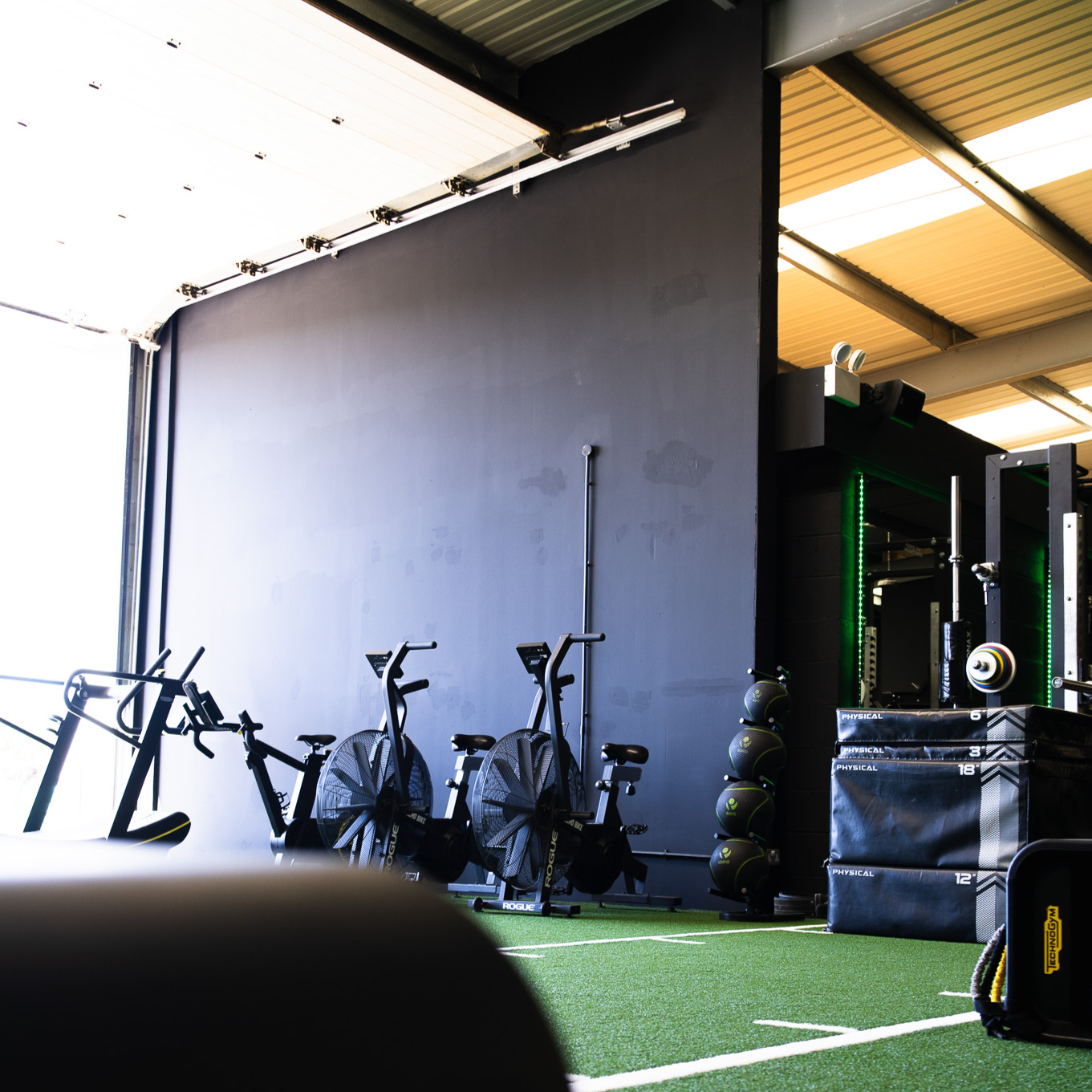assisting lifting weights at aptitude gym near chester in farndon